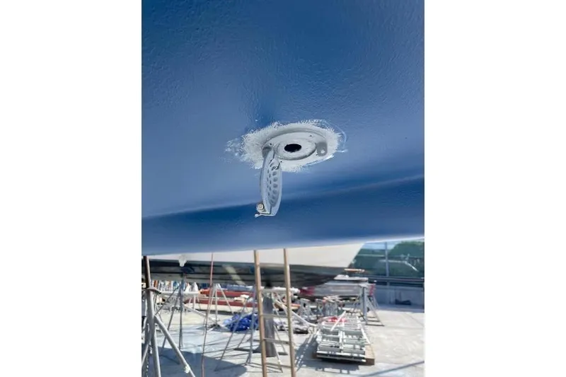 Slide: The Image of Sailing yacht Sabre 426 (2003) with blue spinnaker at sunset on the ocean. - 10