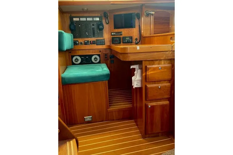 Slide: The Image of Luxurious 2003 Sabre 426 yacht interior with wooden cabinetry and modern kitchen amenities. - 27