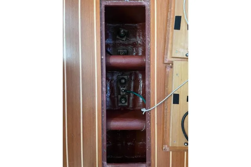 Slide: The Image of 2003 Sabre 426 yacht bathroom with wooden accents and modern fixtures. - 33