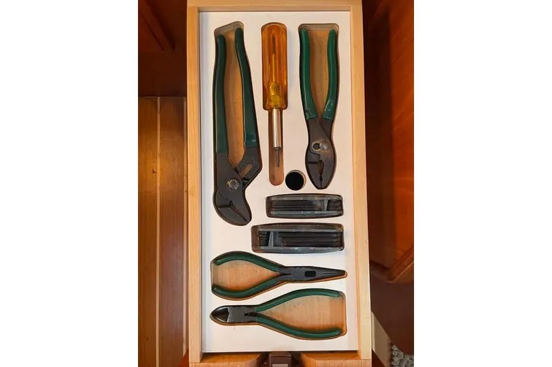 Slide: The Image of Drawer with assorted tools, including pliers and screwdriver, in a Sabre 426, 2003 model. - 40