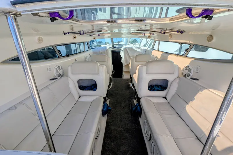 Slide: The Image of Interior of 2000 Advantage Poker Run 40 boat with white seating and modern design. - 11