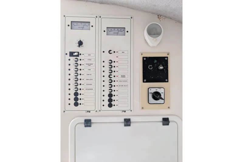 Slide: The Image of Control panel of 2000 Advantage Poker Run 40 boat with switches and gauges. - 12