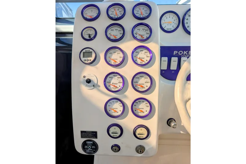 Slide: The Image of Dashboard of a 2000 Advantage Poker Run 40 boat with various gauges and controls. - 14