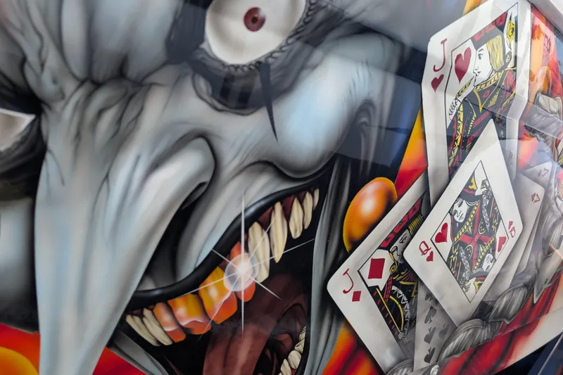 Slide: The Image of Custom airbrushed artwork on 2000 Advantage Poker Run 40 boat, featuring playing cards and a menacing face. - 16