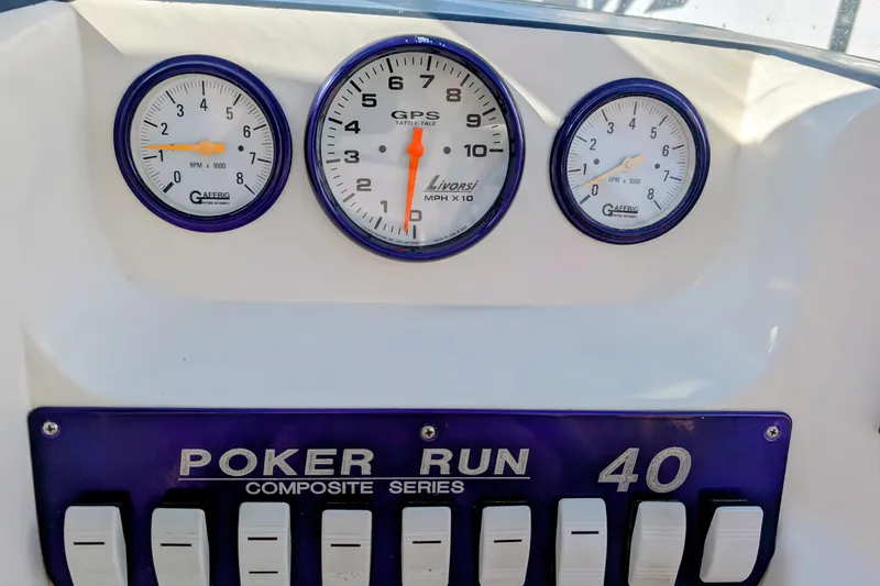 Slide: The Image of Dashboard of 2000 Advantage Poker Run 40 boat with gauges and switches. - 17