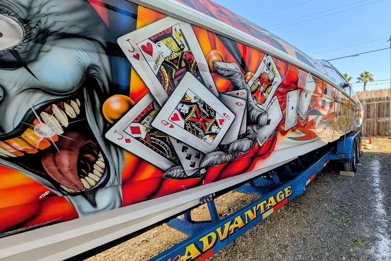 Slide: The Image of Colorful 2000 Advantage Poker Run 40 boat with playing card and joker artwork. - 19