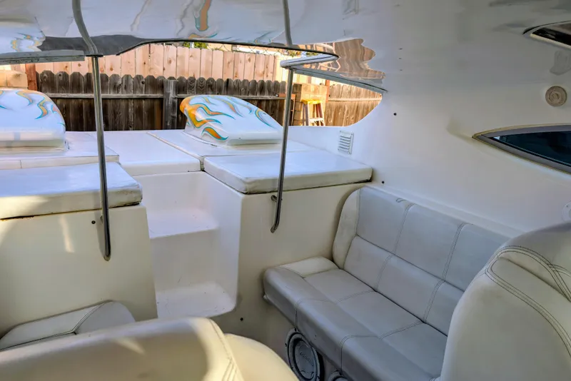 Slide: The Image of Interior of 2000 Advantage Poker Run 40 boat with white seating and colorful accents. - 24