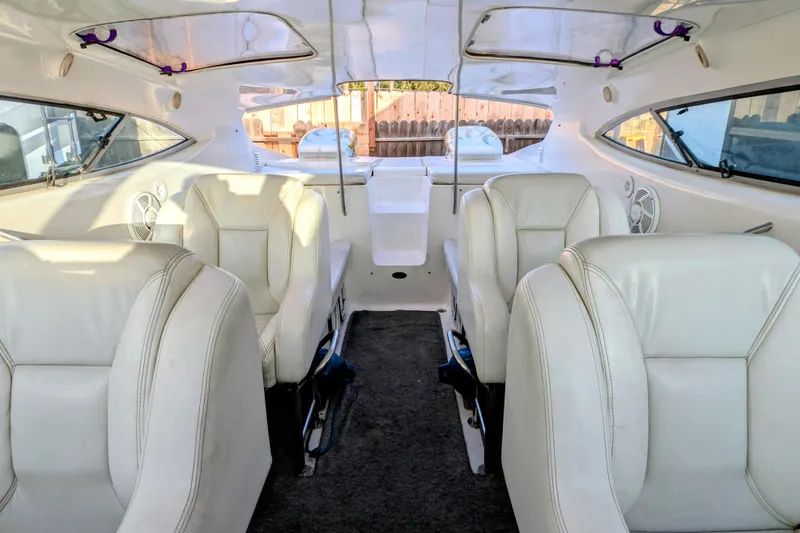 Slide: The Image of Interior of 2000 Advantage Poker Run 40 boat with white leather seats. - 25