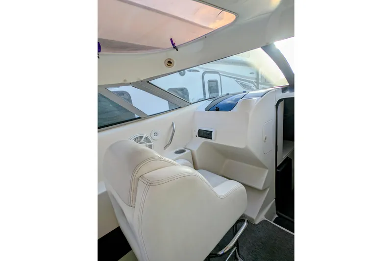 Slide: The Image of Interior of 2000 Advantage Poker Run 40 boat with white seating and dashboard. - 26