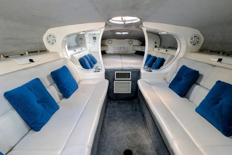 Slide: The Image of Interior of 2000 Advantage Poker Run 40 boat with white seating and blue cushions. - 4