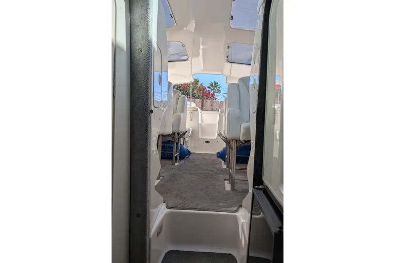 Slide: The Image of Interior view of 2000 Advantage Poker Run 40 boat, featuring seating and windows. - 9