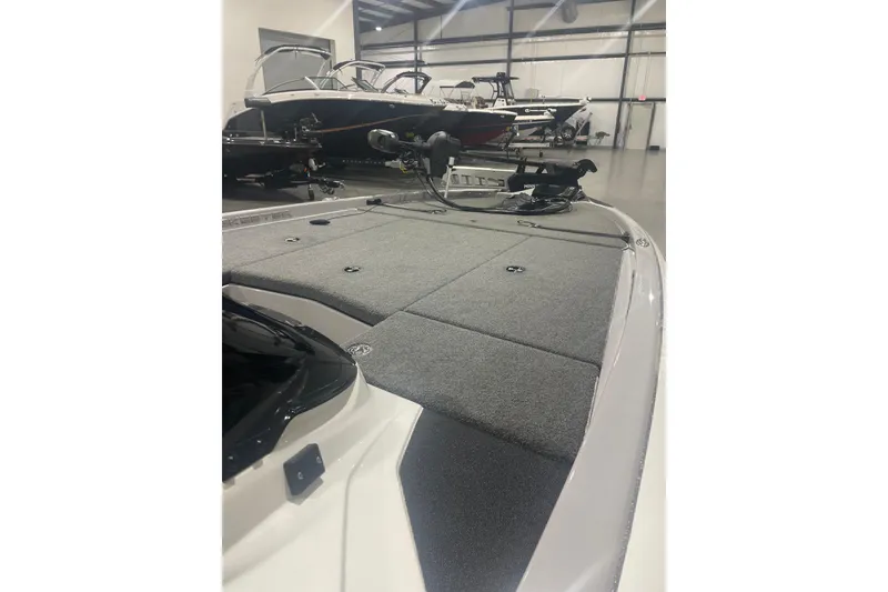 Slide: The Image of 2022 Skeeter ZX200 boat with spacious deck in showroom. - 10
