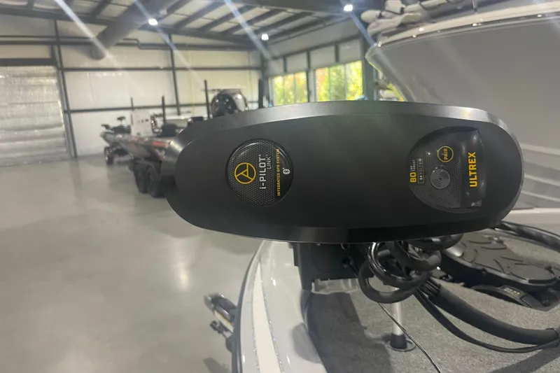 Slide: The Image of 2022 Skeeter ZX200 boat with Ultrex i-Pilot trolling motor in a spacious garage. - 4