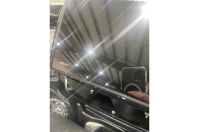 Slide: The Image of 2022 Skeeter ZX200 dashboard featuring a Helix 9 display screen. - 7