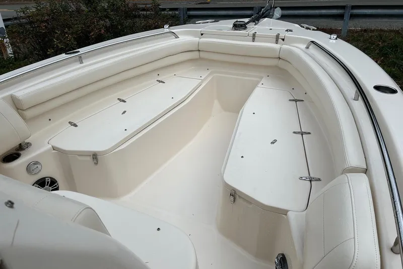 Slide: The Image of 2021 Grady-White Fisherman 257 boat interior with white seating and storage compartments. - 5