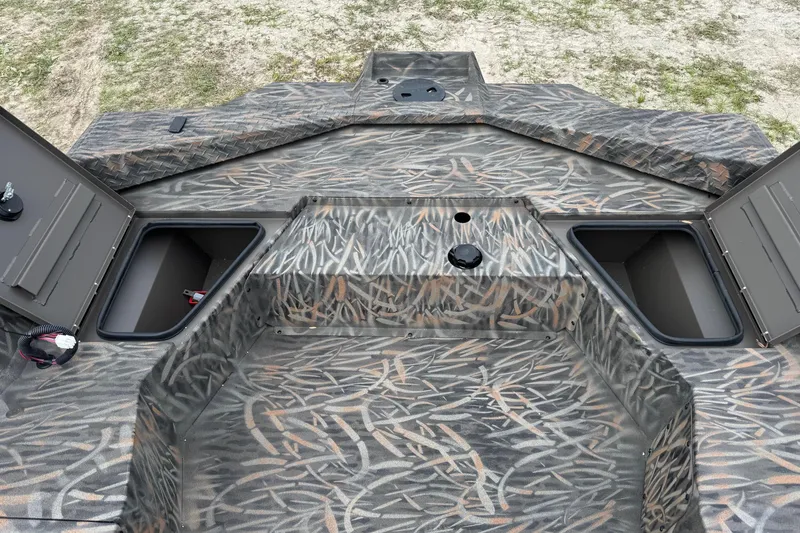 Slide: The Image of 2026 Alweld 1756 Invader boat storage compartments with open lids, showcasing interior space. - 8