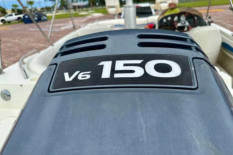 Slide: The Image of 2004 Bennington RL 210 boat with V6 150 engine, close-up view. - 13