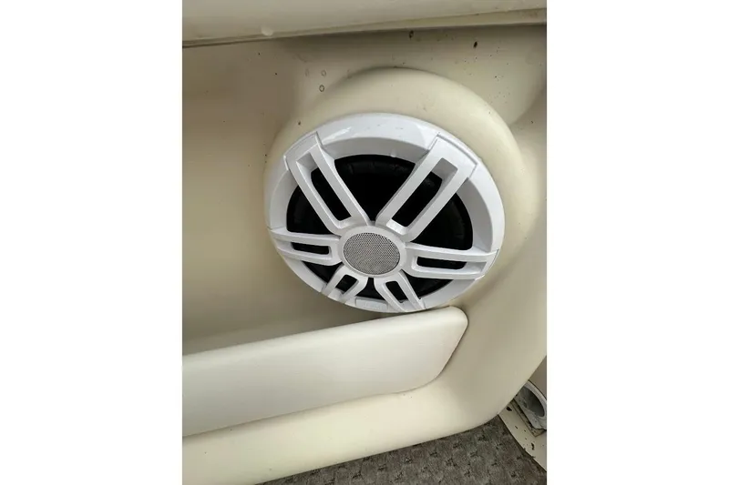 Slide: The Image of White speaker on a 2004 Bennington RL 210 boat interior panel. - 31