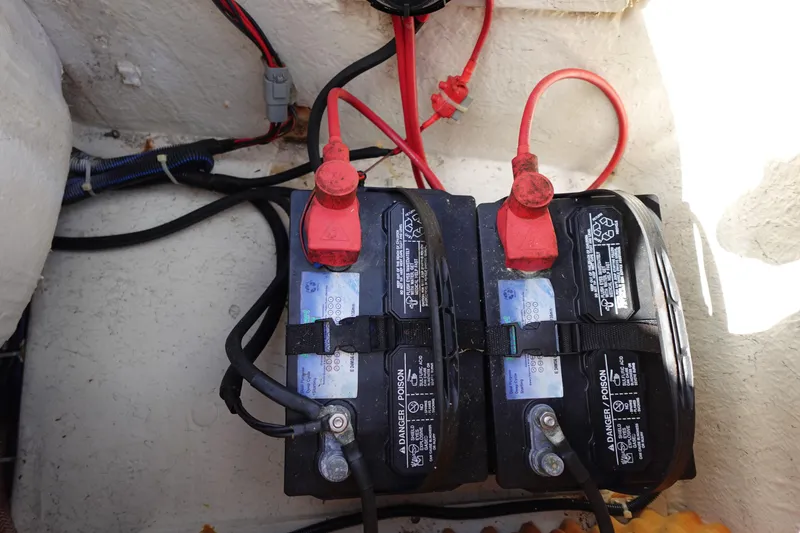 Slide: The Image of Batteries in a 2021 Hurricane Sundeck Sport 218 OB boat, showing wiring and connections. - 18