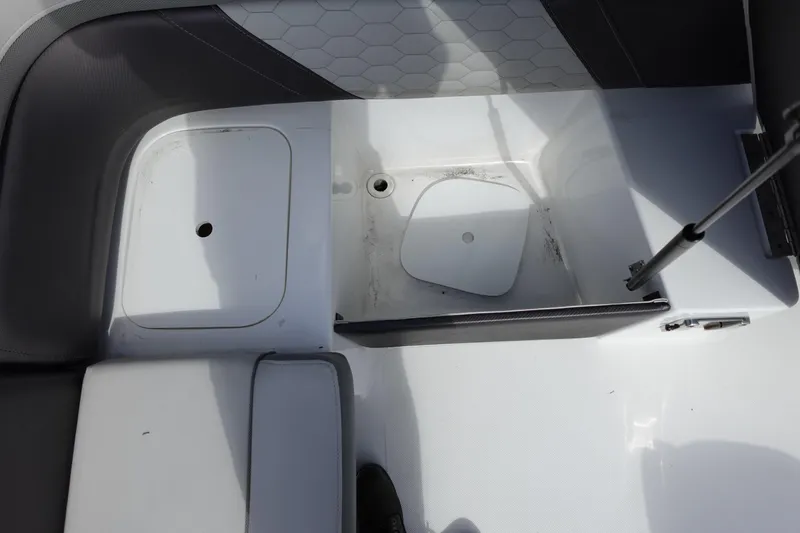 Slide: The Image of 2021 Hurricane Sundeck Sport 218 OB boat storage compartment with open hatch. - 22