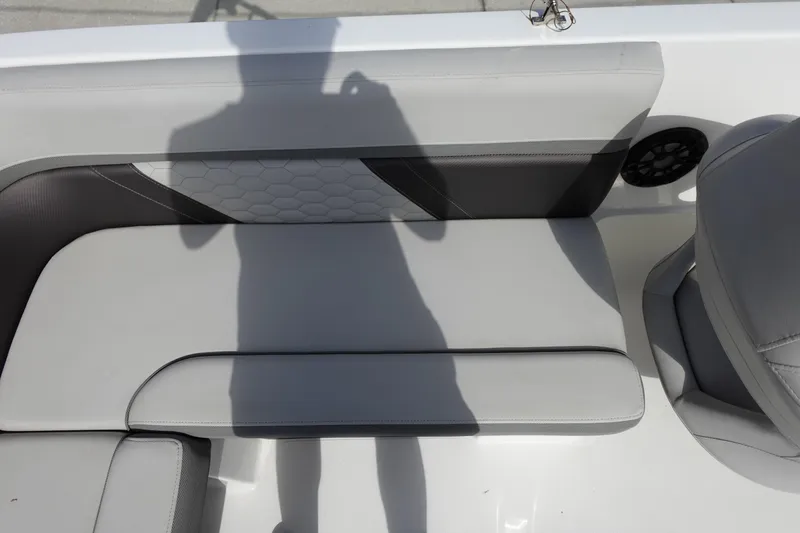 Slide: The Image of 2021 Hurricane Sundeck Sport 218 OB boat interior with gray seating and speaker. - 24