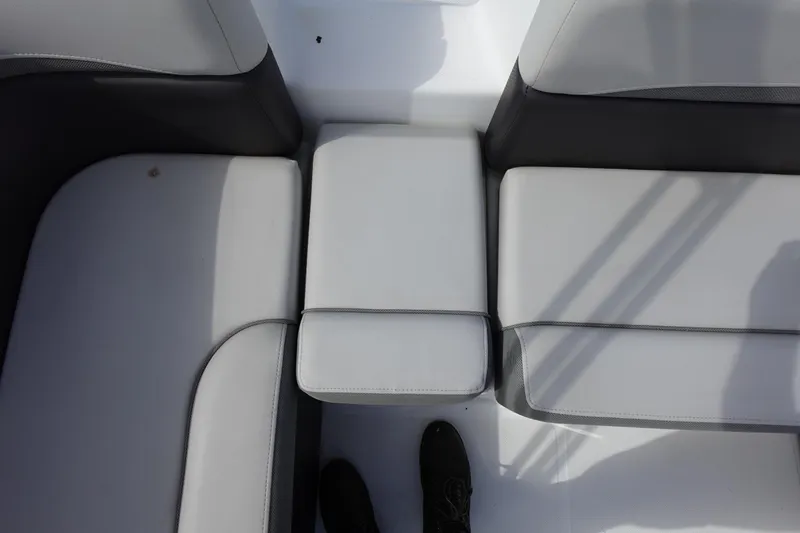Slide: The Image of 2021 Hurricane Sundeck Sport 218 OB boat seating, featuring gray and black cushioned seats. - 27