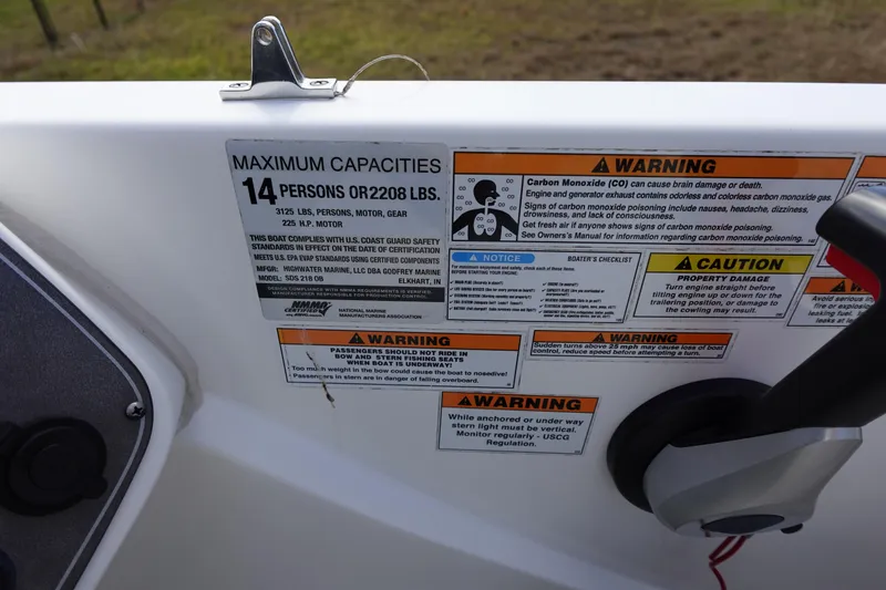 Slide: The Image of 2021 Hurricane Sundeck Sport 218 OB capacity and safety warning labels on boat interior. - 34