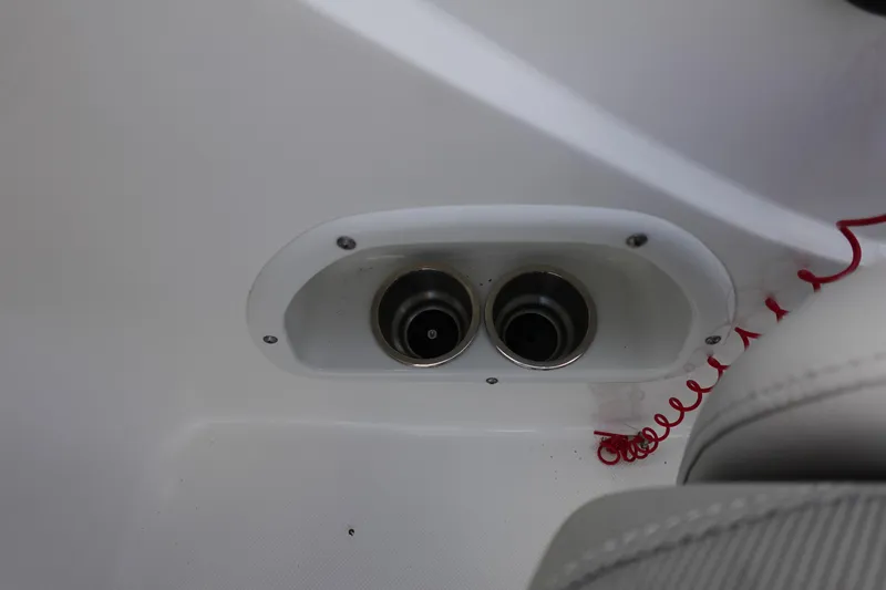 Slide: The Image of Cup holders and red cord in 2021 Hurricane Sundeck Sport 218 OB boat interior. - 35