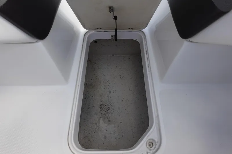 Slide: The Image of Open storage compartment on 2021 Hurricane Sundeck Sport 218 OB boat. - 37