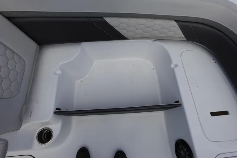 Slide: The Image of 2021 Hurricane Sundeck Sport 218 OB interior seating area with hexagonal pattern upholstery. - 42