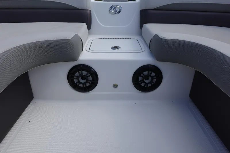 Slide: The Image of Interior seating of 2021 Hurricane Sundeck Sport 218 OB with speakers and storage. - 43