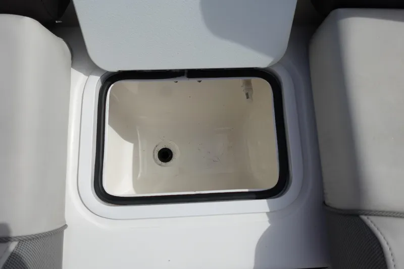 Slide: The Image of Open storage compartment on 2021 Hurricane Sundeck Sport 218 OB boat. - 45