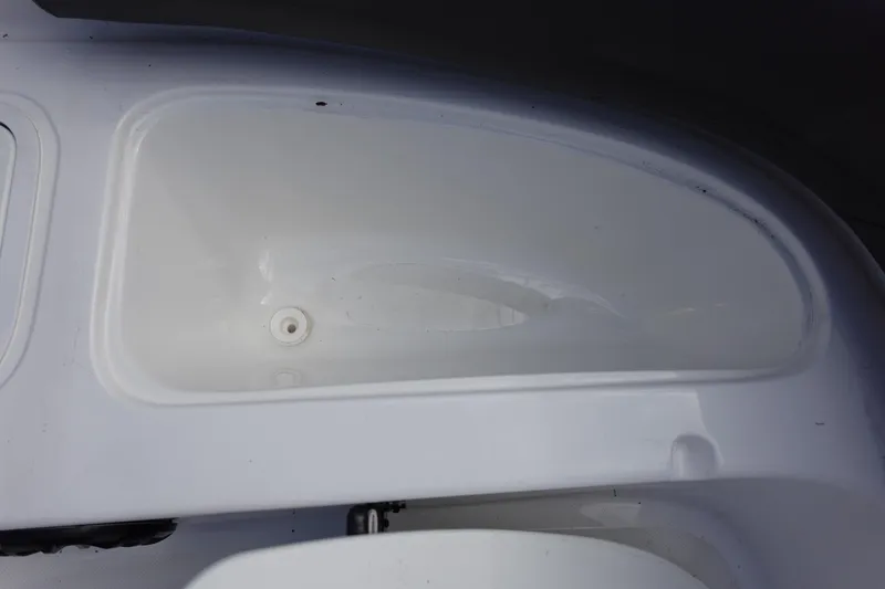 Slide: The Image of 2021 Hurricane Sundeck Sport 218 OB boat storage compartment, white interior. - 47