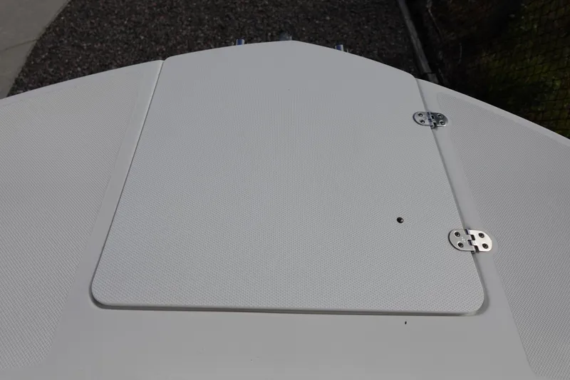 Slide: The Image of 2021 Hurricane Sundeck Sport 218 OB boat deck with textured surface and metal hinges. - 50