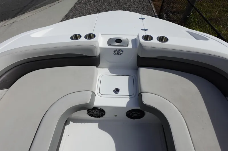 Slide: The Image of 2021 Hurricane Sundeck Sport 218 OB boat interior with cushioned seating and cup holders. - 52