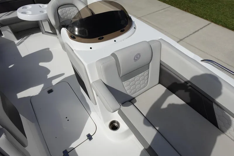 Slide: The Image of 2021 Hurricane Sundeck Sport 218 OB boat interior with seating and console. - 53