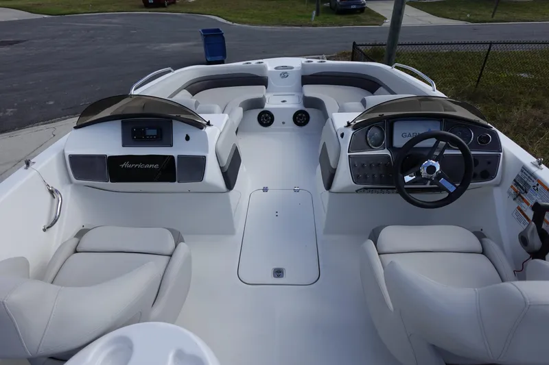 Slide: The Image of 2021 Hurricane Sundeck Sport 218 OB boat interior with seating and steering console. - 55