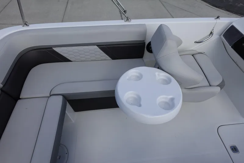 Slide: The Image of 2021 Hurricane Sundeck Sport 218 OB boat interior with seating and cup holder. - 58