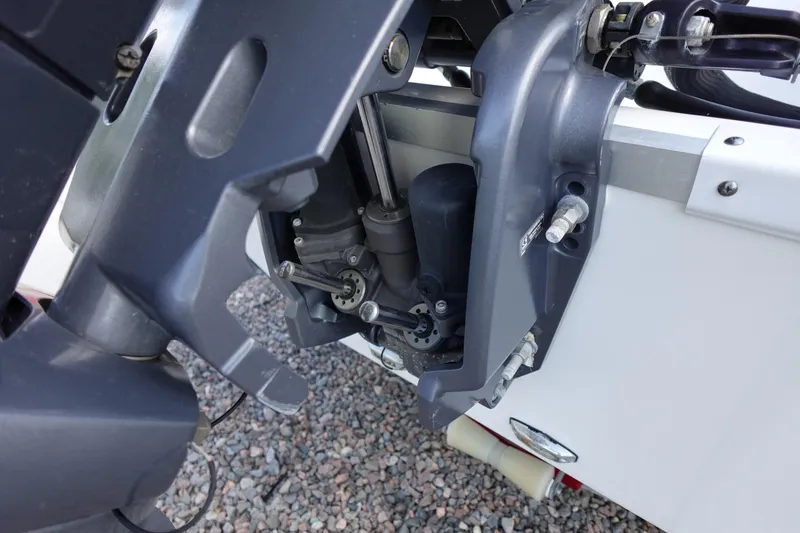Slide: The Image of 2021 Hurricane Sundeck Sport 218 OB outboard motor close-up, showcasing mechanical components. - 61