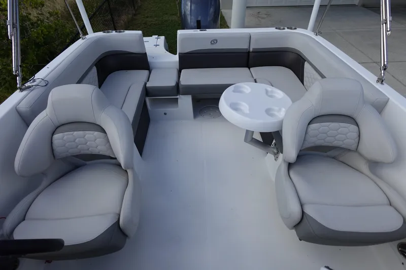 Slide: The Image of 2021 Hurricane Sundeck Sport 218 OB boat interior with plush seating and round table. - 65