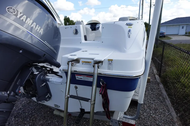 Slide: The Image of 2021 Hurricane Sundeck Sport 218 OB boat with Yamaha outboard motor and swim ladder. - 69