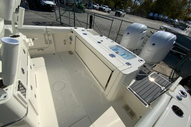 Slide: The Image of 2026 Cobia 265 Center Console boat with dual engines and spacious deck layout. - 17
