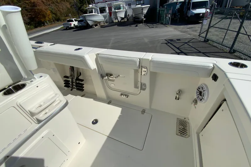 Slide: The Image of 2026 Cobia 265 Center Console boat interior with storage and seating features. - 25