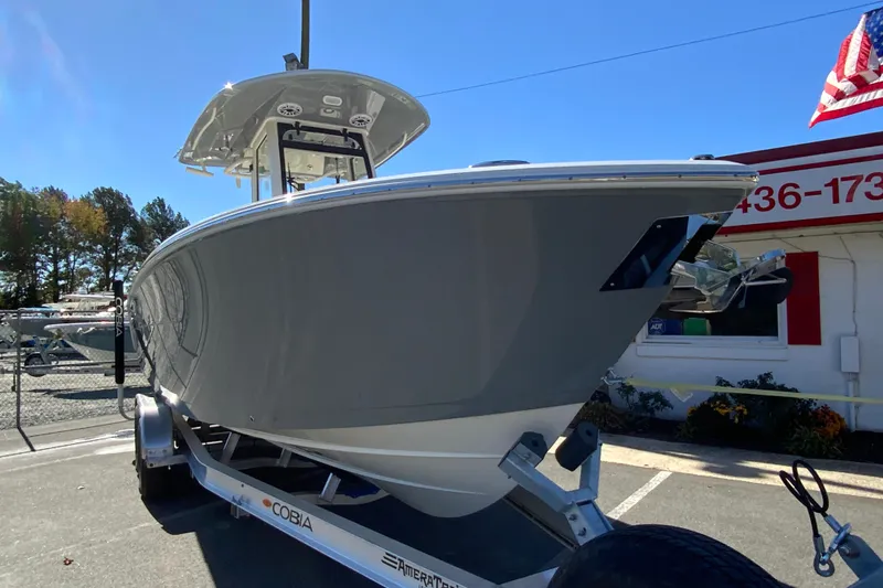 Slide: The Image of 2026 Cobia 265 Center Console boat on trailer, displayed outdoors. - 3