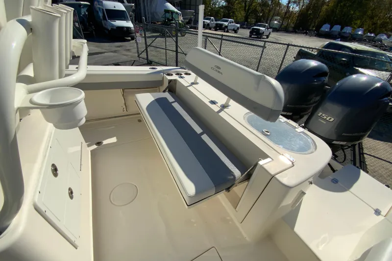 Slide: The Image of 2019 Cobia 262 Center Console boat interior with seating and dual engines. - 20