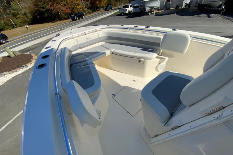 Slide: The Image of 2019 Cobia 262 Center Console boat with spacious seating and sleek design. - 22