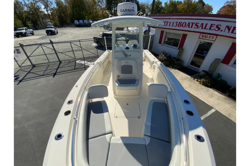 Slide: The Image of 2019 Cobia 262 Center Console boat with Garmin equipment, parked at a sales lot. - 24