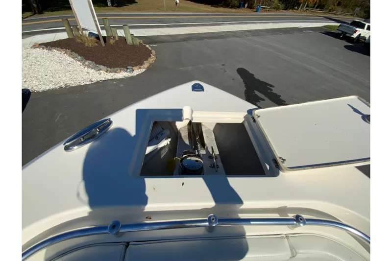 Slide: The Image of 2019 Cobia 262 Center Console boat deck with open storage compartment. - 25