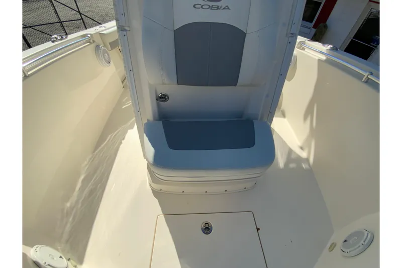 Slide: The Image of 2019 Cobia 262 Center Console boat interior with seating and storage. - 27