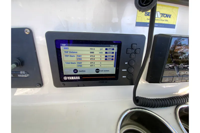 Slide: The Image of Yamaha display on 2019 Cobia 262 Center Console showing trip data and fuel usage. - 33